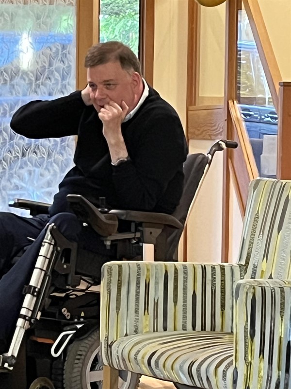 Image of a wheelchair user in a room.