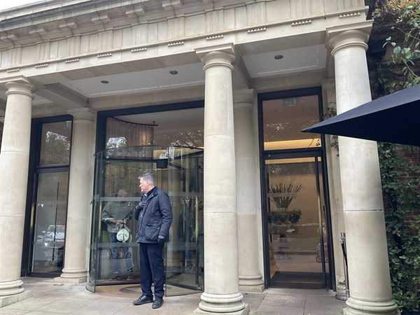 Image of a person standing in an entrance way