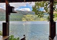 Image of a seating area by a loch