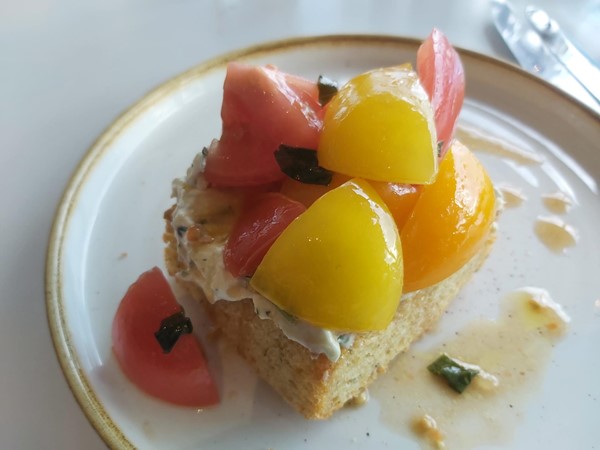Grilled focaccia, herb and lemon mascarpone, marinated tomatoes