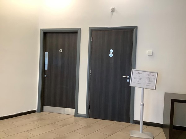 The toilets lie beyond reception desk and by the main staircase