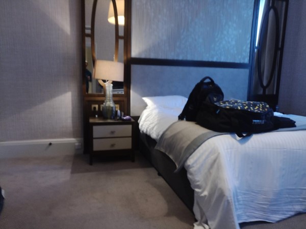 Accessible bedroom with pletny of space next to the bed.