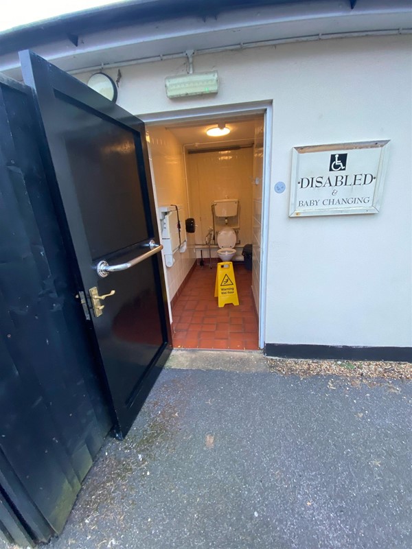 Image of an accessible toilet door