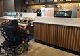 Image of me sitting at the counter of Starbucks.