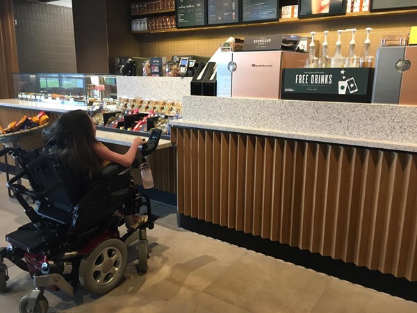 Image of me sitting at the counter of Starbucks.