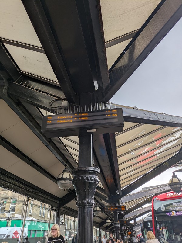 Image of an electrical information, board underneath a bus shelter