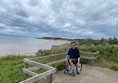 Paul, wheels across the viewing area to admire the views along the beach