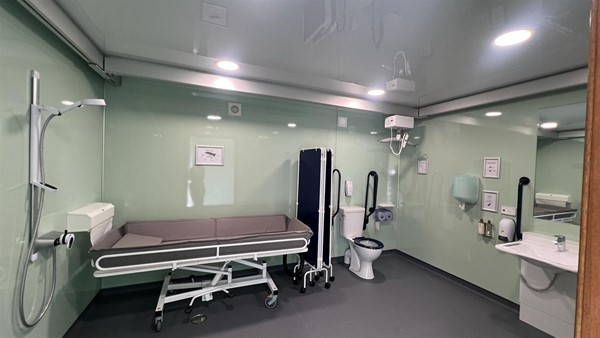Shower, Changing Table, Toilet Ceiling Track hoist sink and grab rails