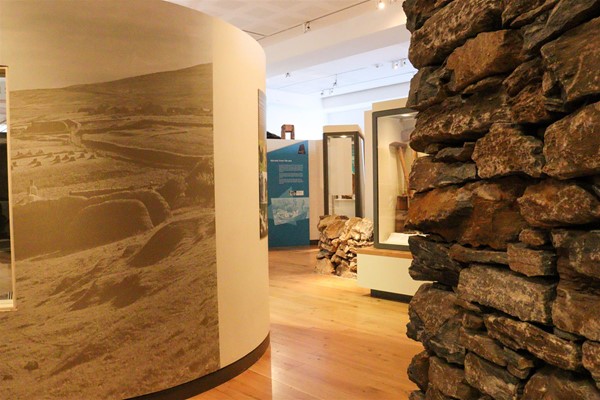 Wooden level floor between areas of the exhibition.