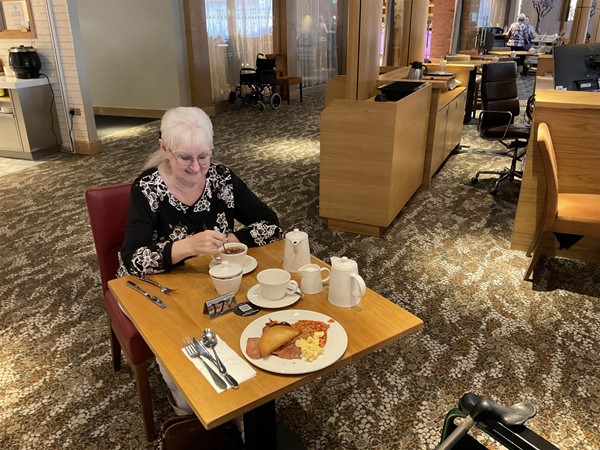 Image of a person seated at a table