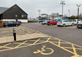 Picture of hotel and carpark with an accessible parking space