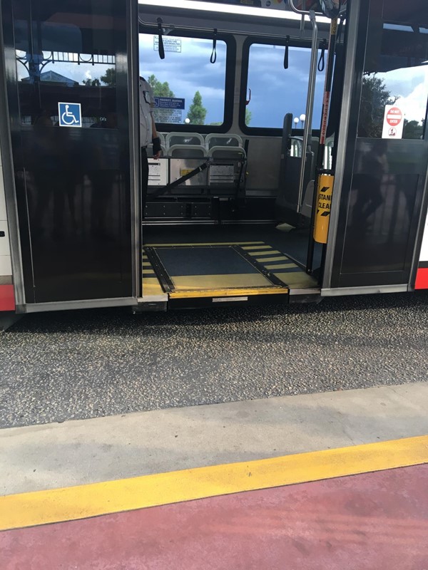 The electronic ramp on the bus.