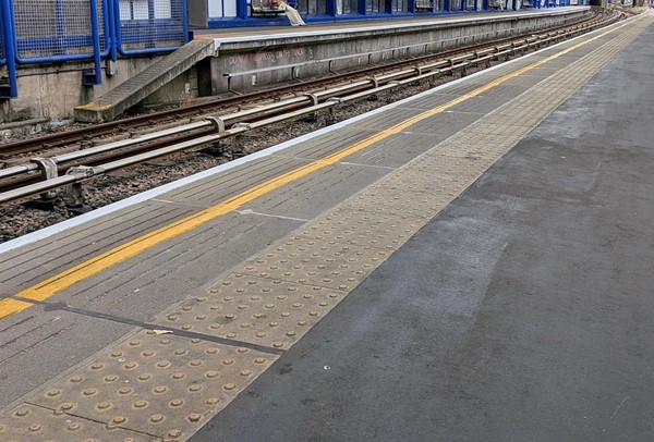 Image of tactile paving at the edge of the platform