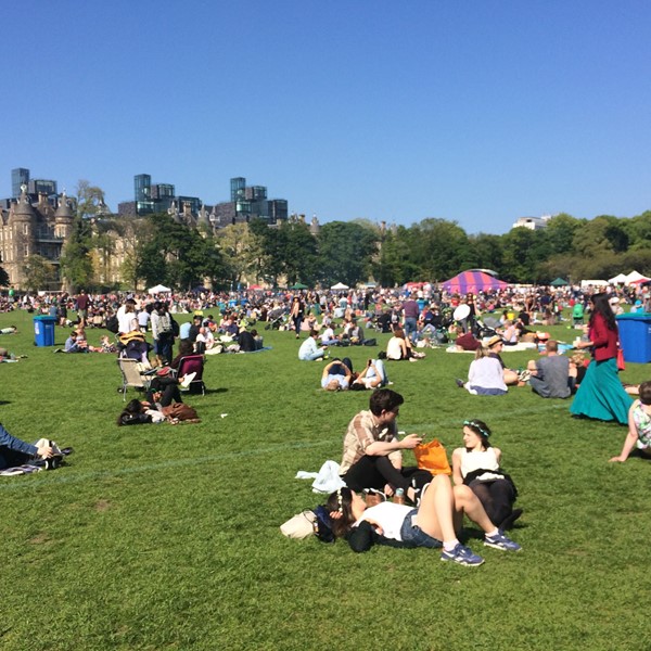 Photo of festival goers in the sun.