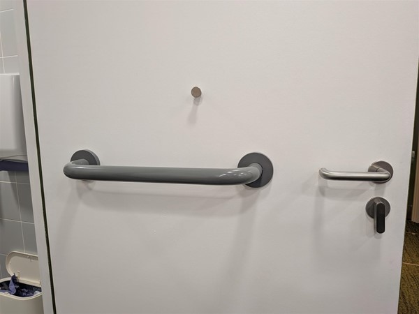 image of the inside of the door to the accessible bathroom
