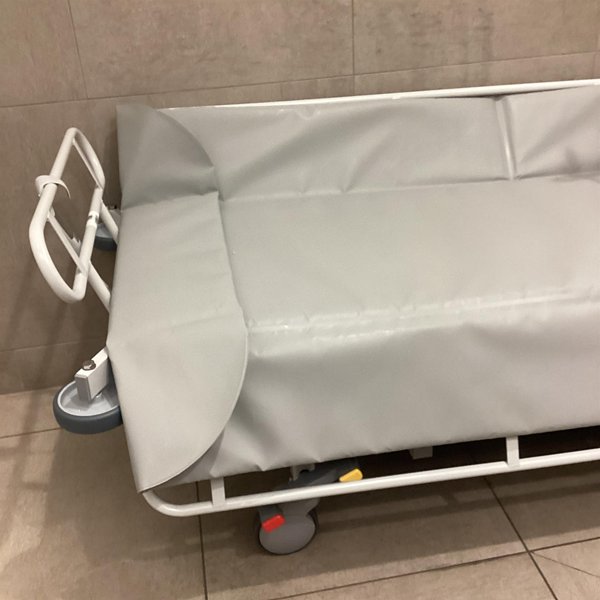 Height adjustable changing bed