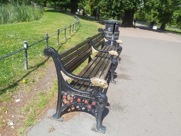 Bench with Clissold Park on the metal work
