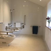 Valley View wet room with support rails and shower seat