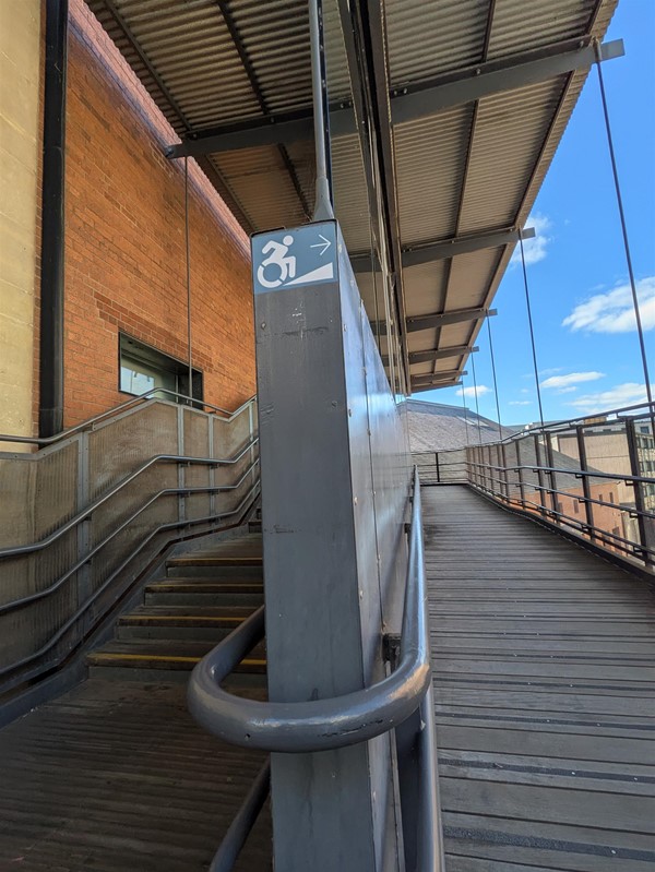Image of ramp and stairs at the accessible entrance