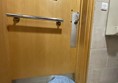 Image of a wooden door with a silver handle