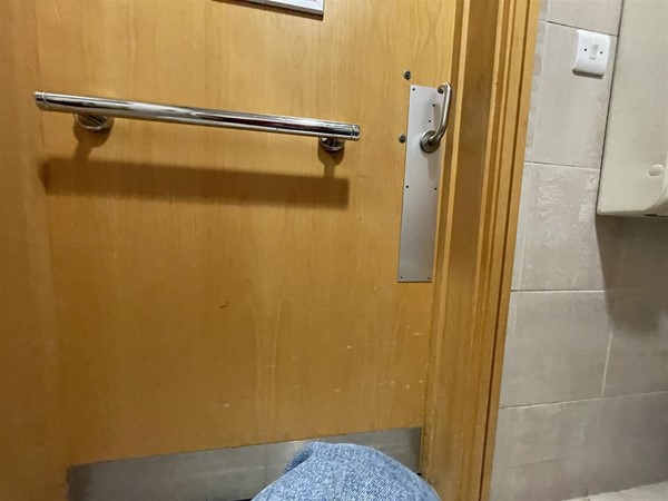 Image of a wooden door with a silver handle