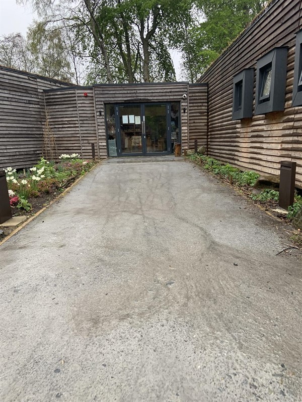 Image of a wide path leading to double doors