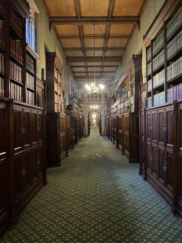 A hallowed hallway... very worn carpets but wide