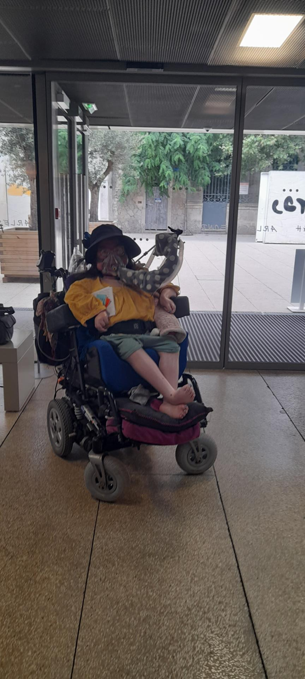 Image of a powerchair user