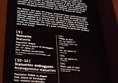 High up information panels with small hard to read writing, sometimes deformed