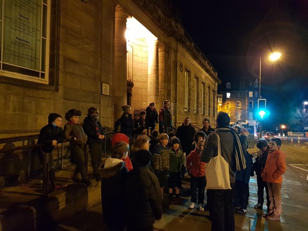 Cubs standing outside the library