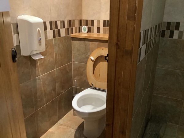 Picture of an open toilet cubicle