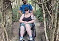 Image of two people under an archway made of trees
