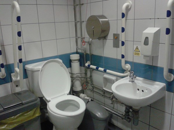 Ground floor accessible toilet with emergency cord wrapped round the pipe