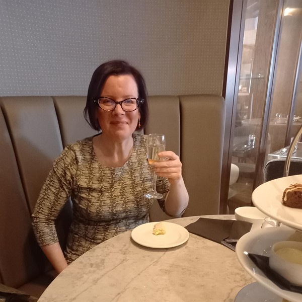 Image of a person at a restaurant table