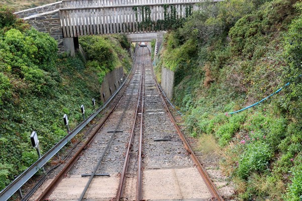 View from carriage down the railway, which is steep and has bushes on each side