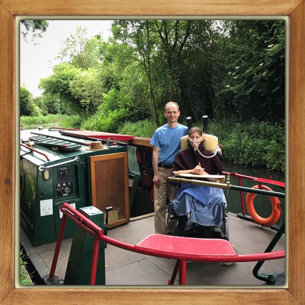 Powered wheelchair user on a canal boat
