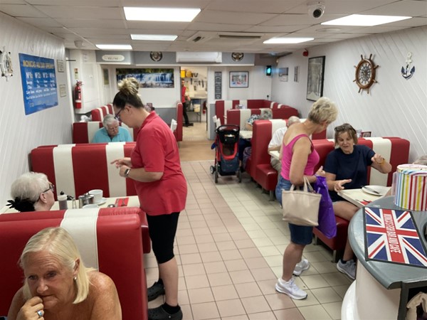 Image of people seated in an interior dining area