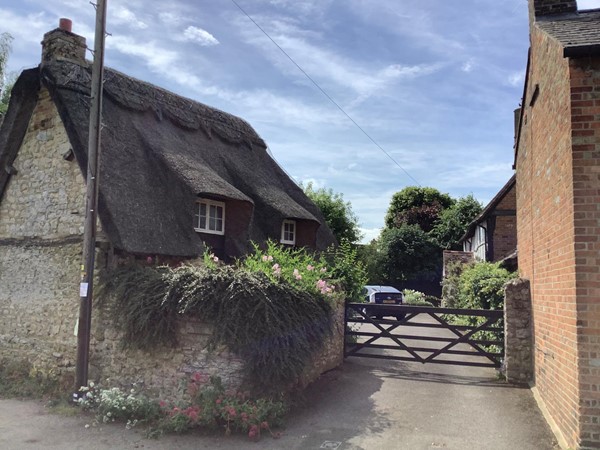 Picture of a wooden gate between two houses