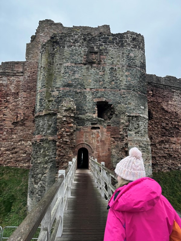 Wooden bridge entry to castle (leads to cobbles and then grass)