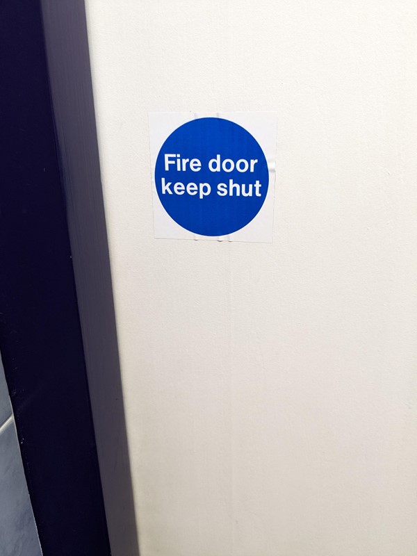 Visible sign, why are STAFF opening this door