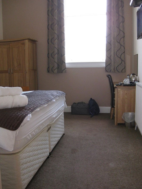 Picture of Grammer Lodge - Room, full tea making. Note high ceiling. Bed height was challenging for wheelchair transfer.