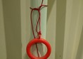Picture of EAT, One New Change - Red Cord tied up out of reach around a grabrail.