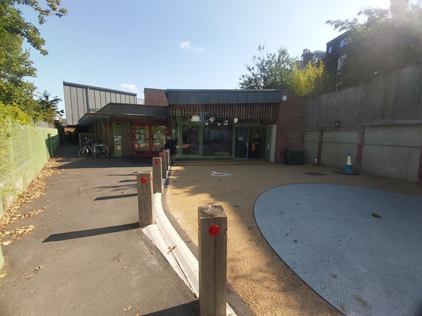 Path with wooden bollards on the right leading to the Highbury Roundhouse