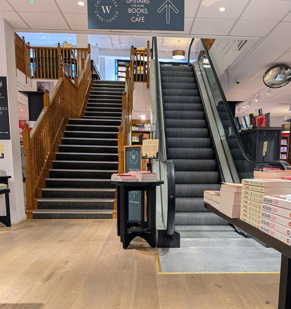 Image of stairs and escalator between the floors