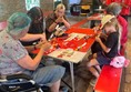 Image of people doing activities on a table