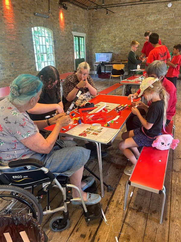 Image of people doing activities on a table