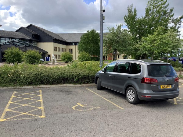 Picture of a car parked in a parking space
