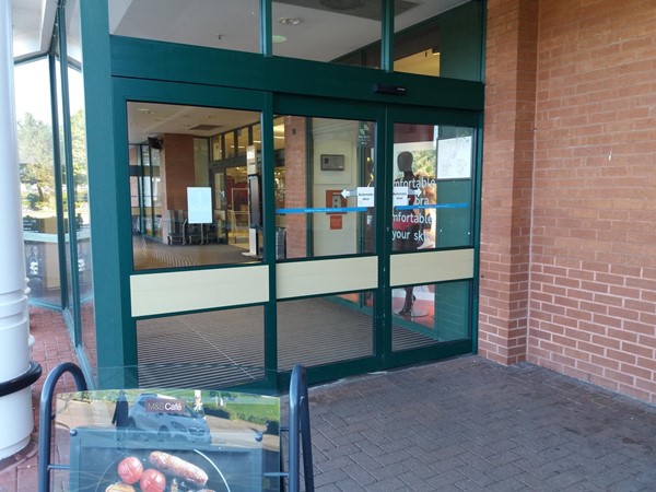 Main entrance with automatic doors.  Theres another automatic door inside.