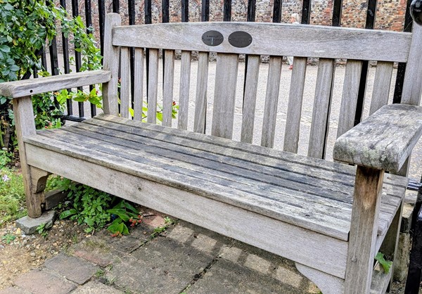Image of wooden bench by the entrance