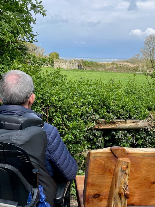 Picture of a man looking at ruined wall